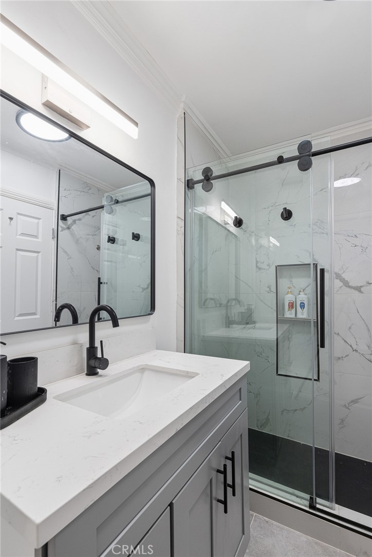 8701 Delgany Avenue, Unit 110 Playa del Rey, CA 90293 - Photo 17 of 22 a bathroom with a sink shower and a mirror