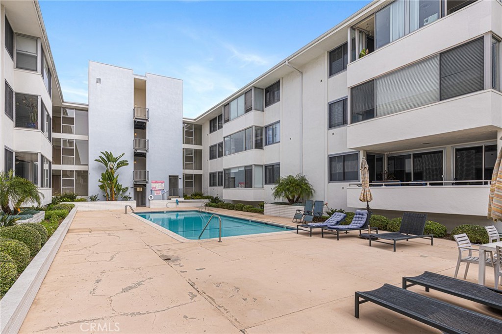 8701 Delgany Avenue, Unit 110 Playa del Rey, CA 90293 - Photo 19 of 22 a view of a house with swimming pool and sitting area