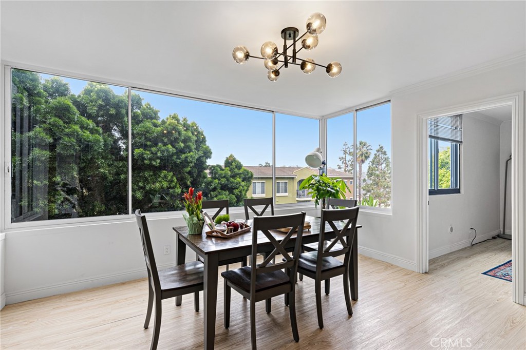 8701 Delgany Avenue, Unit 110 Playa del Rey, CA 90293 - Photo 7 of 22 a view of a dining room with furniture window and wooden floor