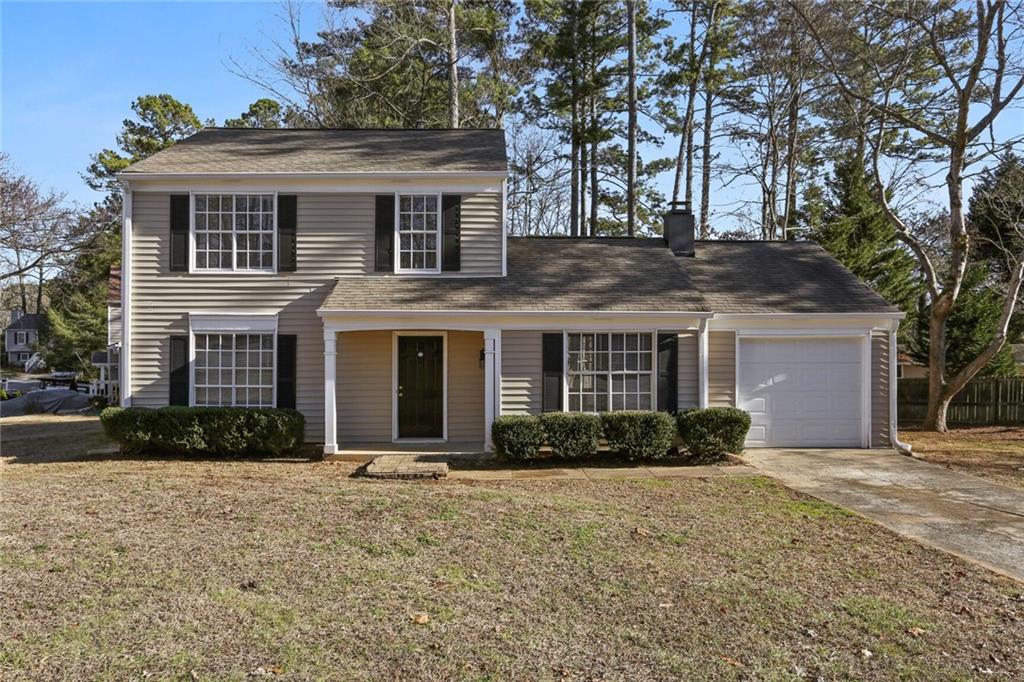 2988 Carrie Farm Road Northwest Kennesaw, GA 30144 - Photo 1 of 1 a front view of a house with garden