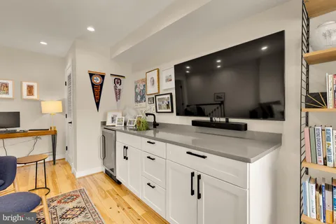 a bathroom with double vanity sink and mirror