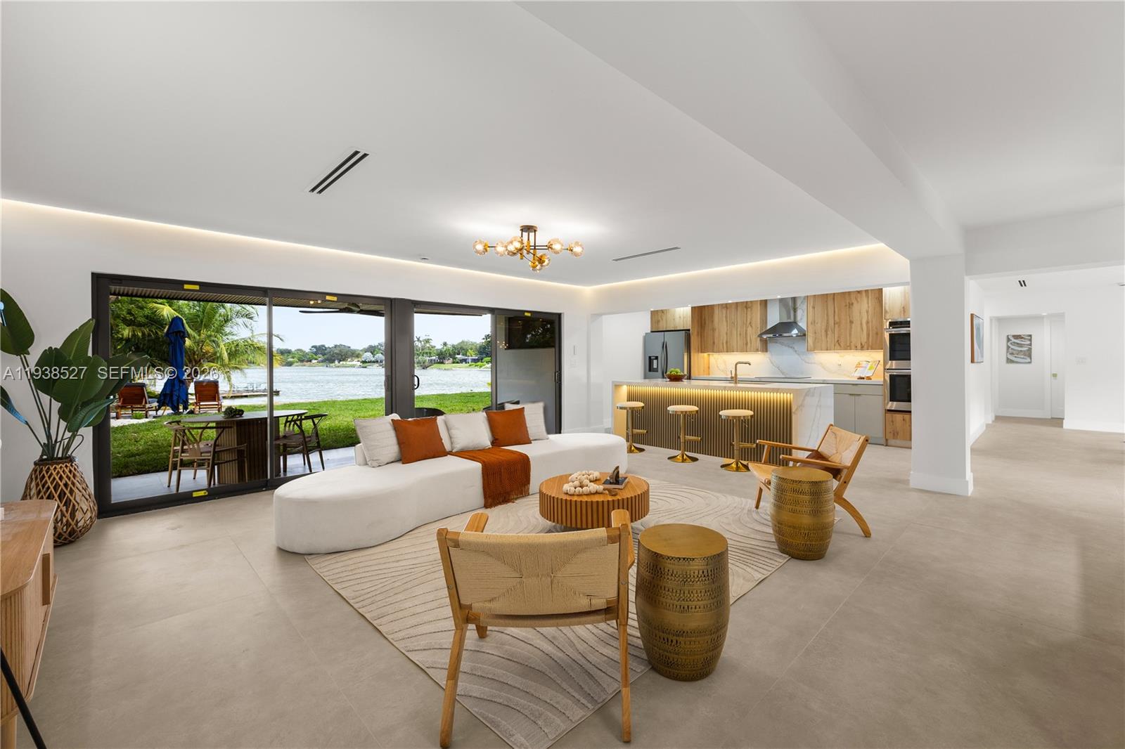 10415 Southwest 87th Avenue Miami, FL 33156 - Photo 11 of 53 a living room with fireplace furniture and a large window