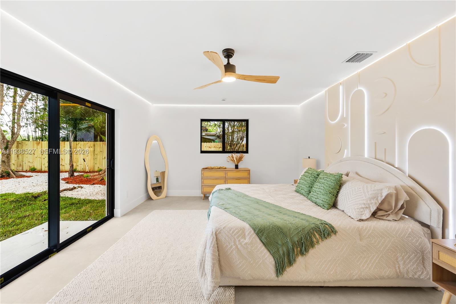 10415 Southwest 87th Avenue Miami, FL 33156 - Photo 23 of 53 a bedroom with a large bed and a window