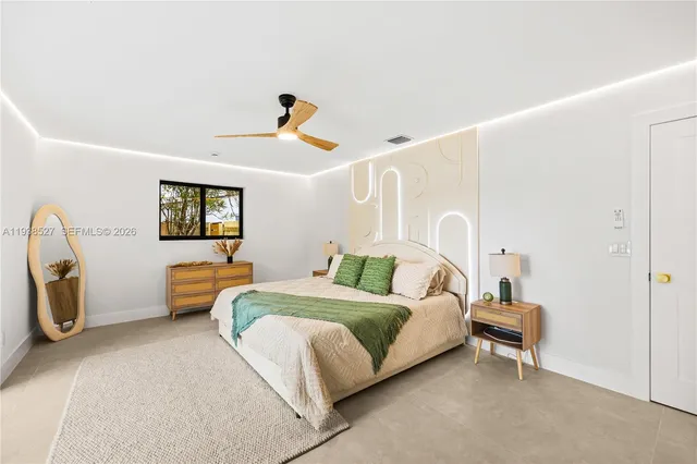 a bedroom with bed and a window