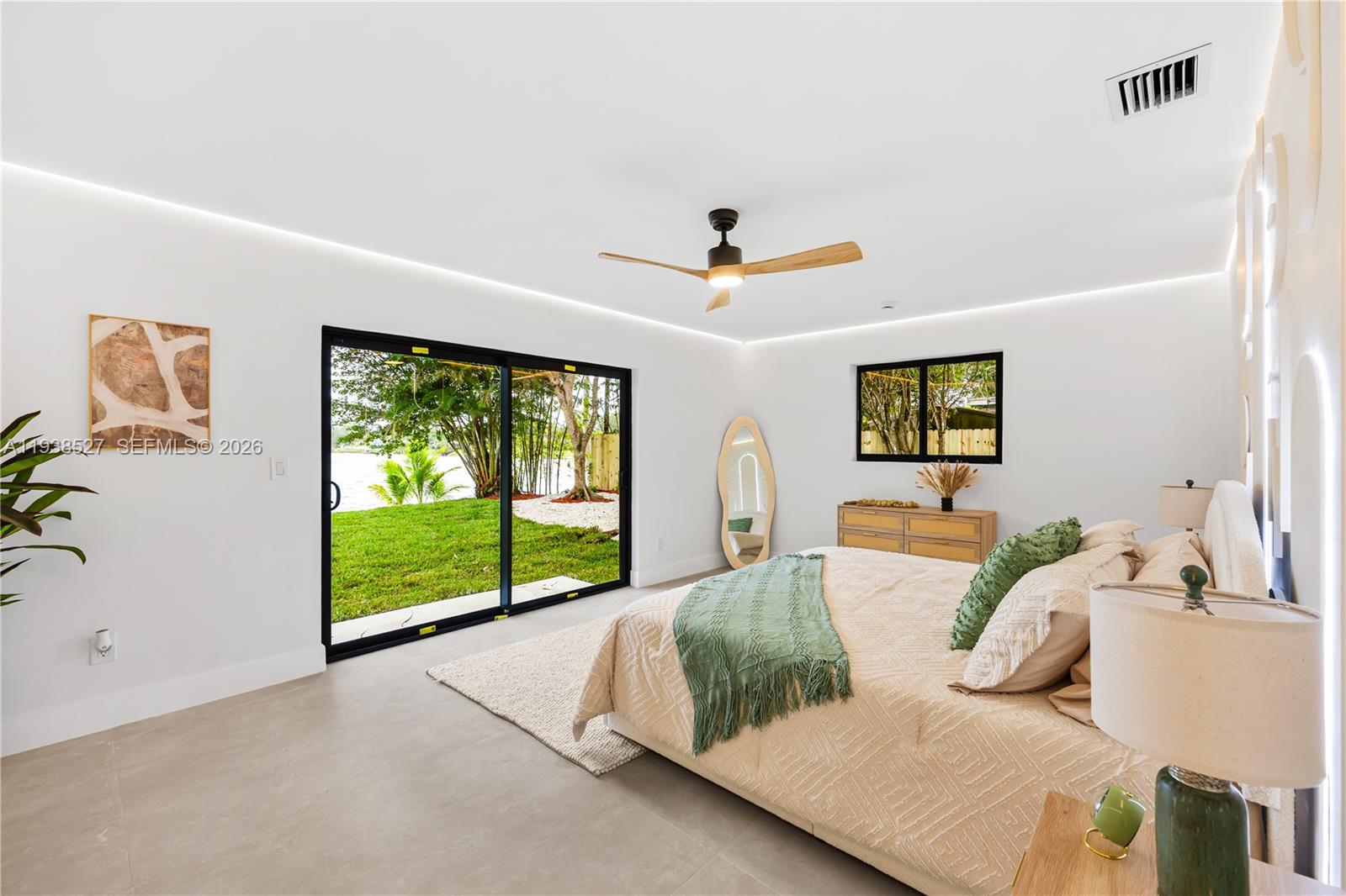 10415 Southwest 87th Avenue Miami, FL 33156 - Photo 26 of 53 a living room with furniture and a flat screen tv