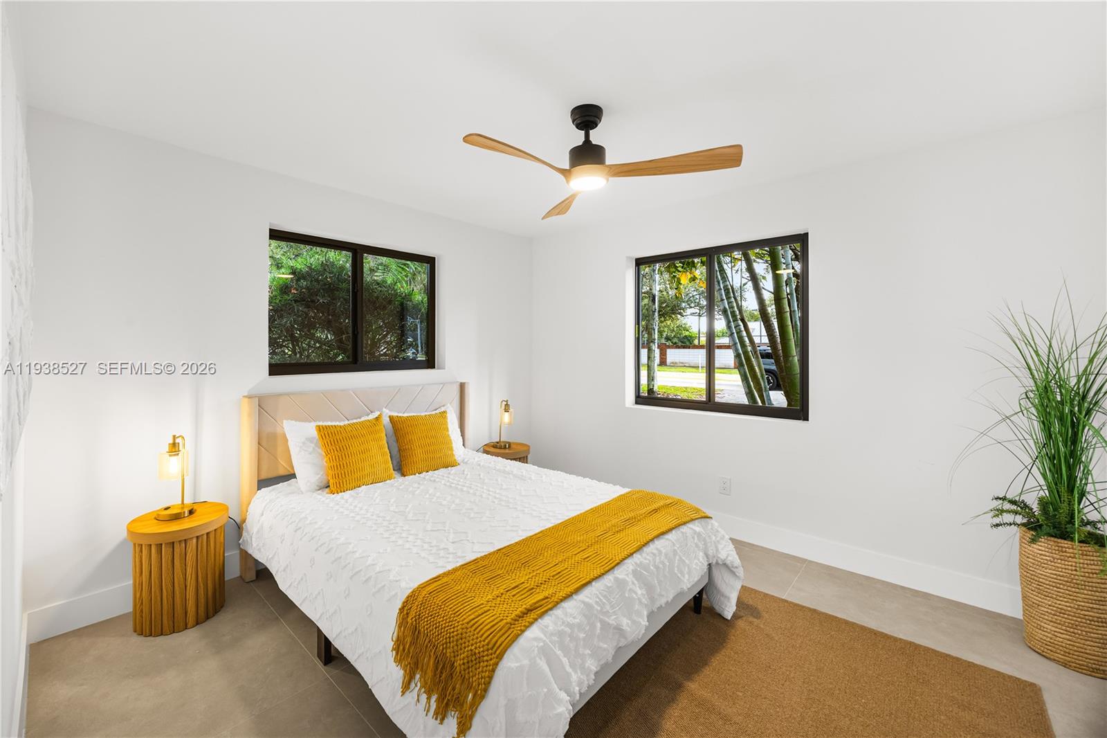 10415 Southwest 87th Avenue Miami, FL 33156 - Photo 30 of 53 a bedroom with a bed and a potted plant