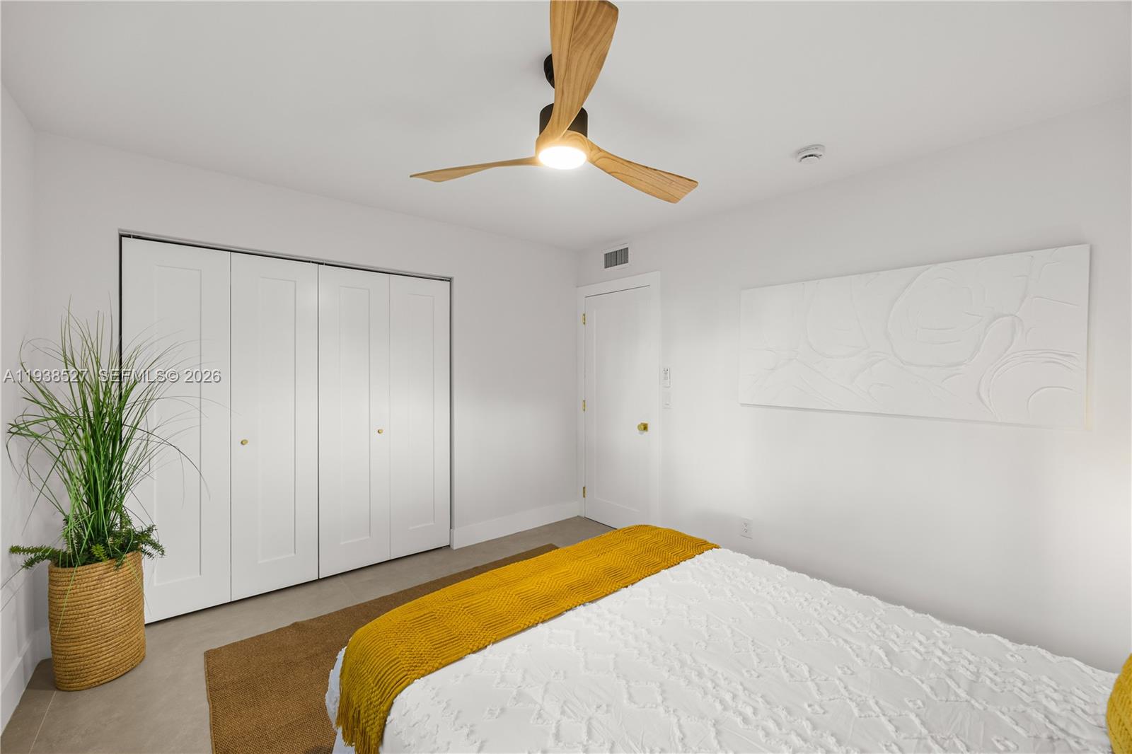 10415 Southwest 87th Avenue Miami, FL 33156 - Photo 31 of 53 a bedroom with a bed and a potted plant