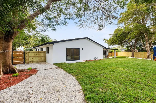 a house view with a garden space