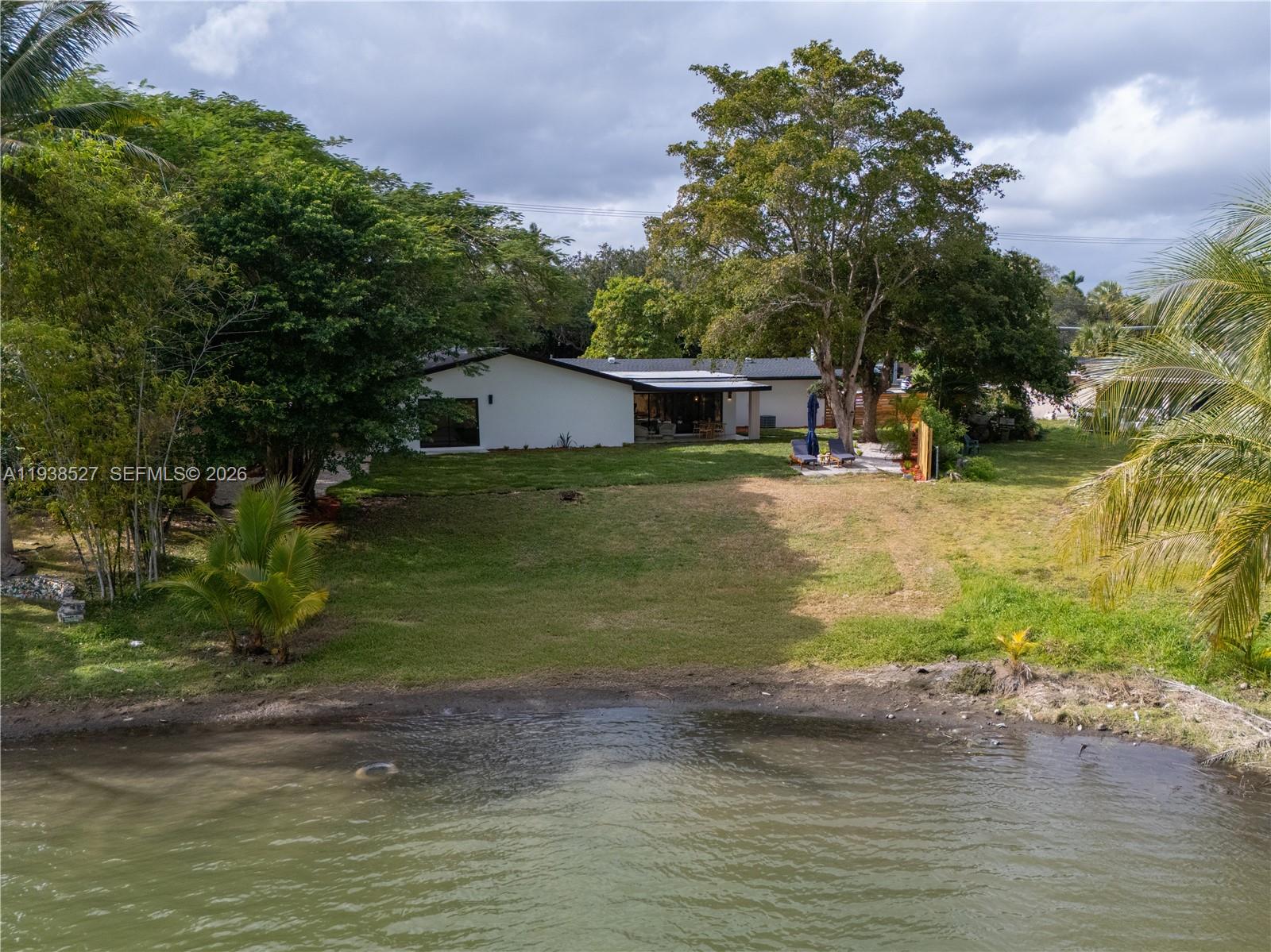 10415 Southwest 87th Avenue Miami, FL 33156 - Photo 47 of 53 a view of a house with a yard