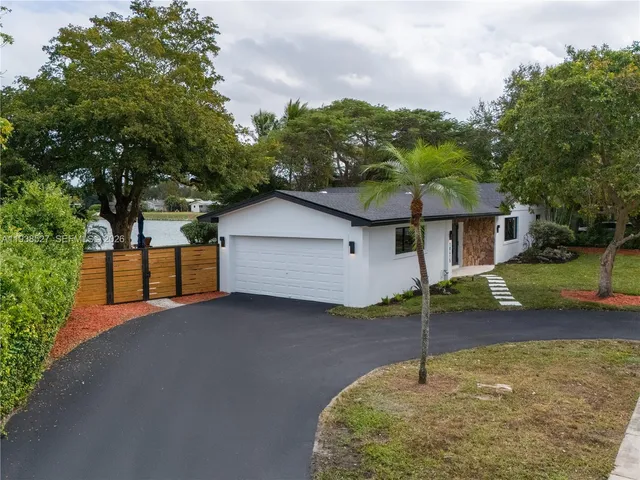 a house view with a backyard space