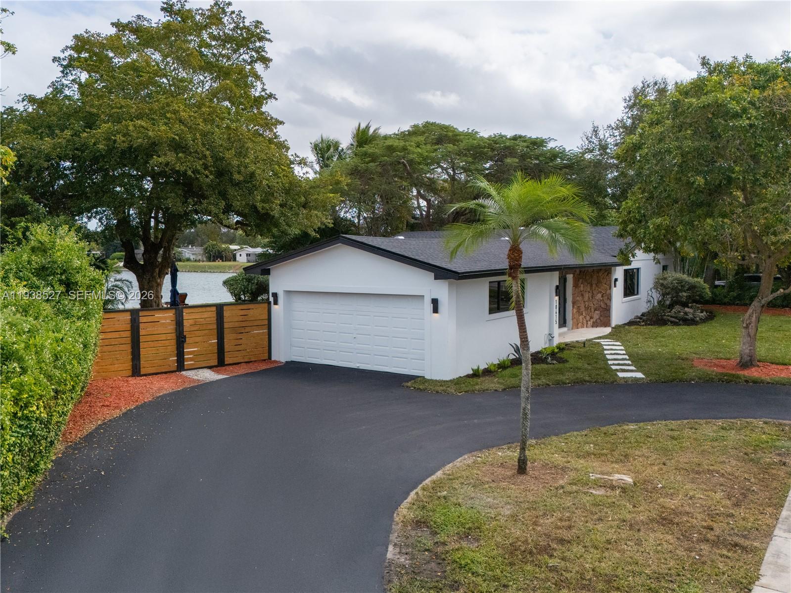 10415 Southwest 87th Avenue Miami, FL 33156 - Photo 6 of 53 a house view with a backyard space