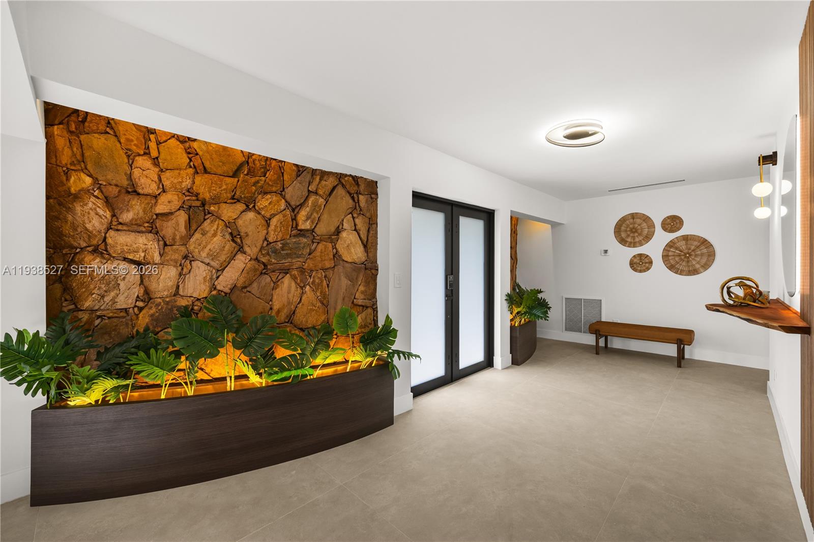 10415 Southwest 87th Avenue Miami, FL 33156 - Photo 8 of 53 an empty room with painted walls and a large window