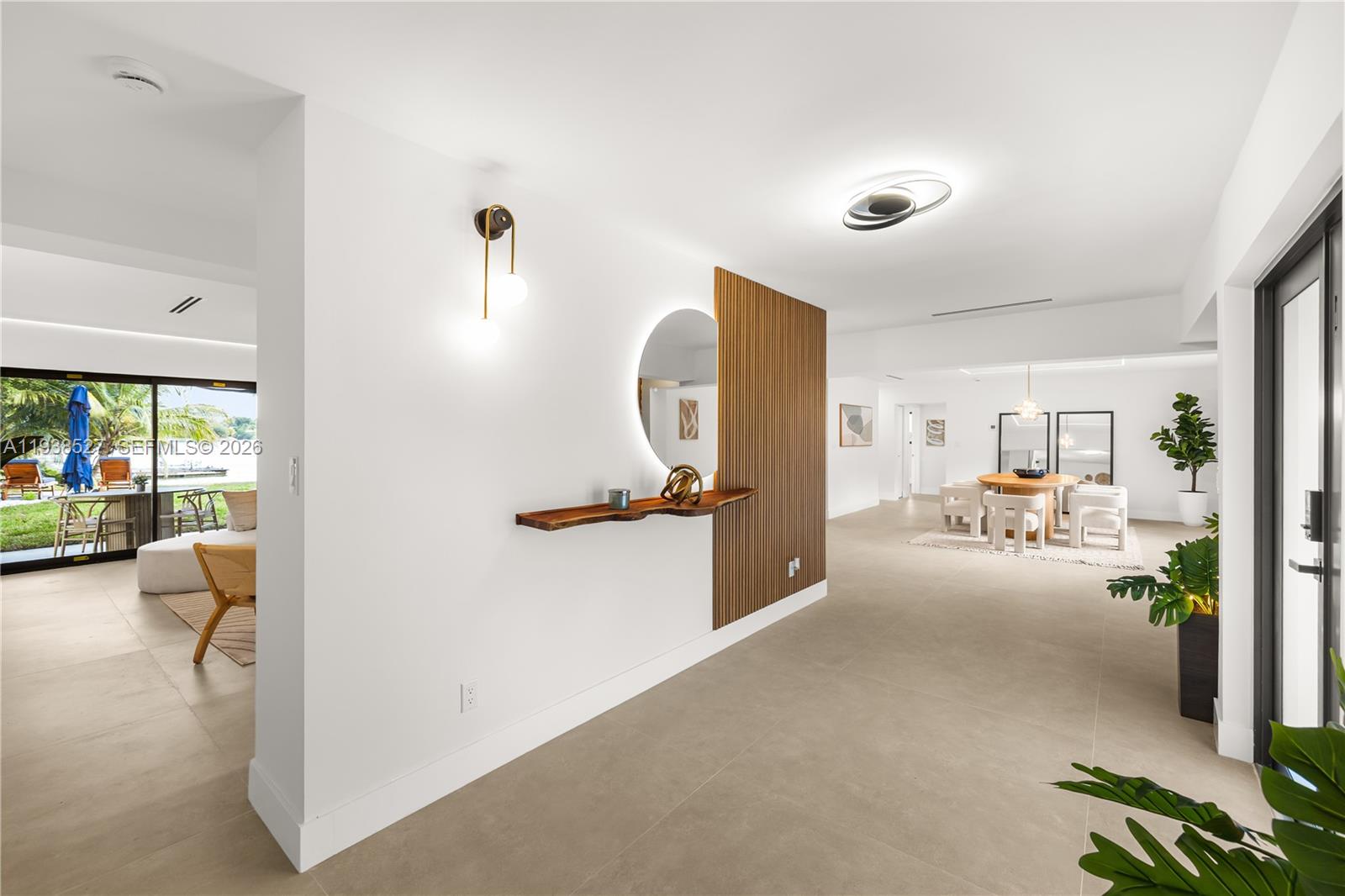 10415 Southwest 87th Avenue Miami, FL 33156 - Photo 9 of 53 a view of a livingroom with furniture and a floor to ceiling window