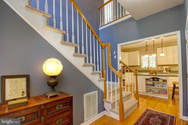 a view of a livingroom with furniture staircase and a living room