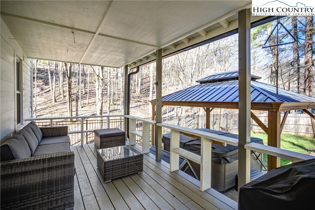 148 Fox Hill Road Vilas, NC 28692 - Photo 14 of 25 a living room with furniture and a large window