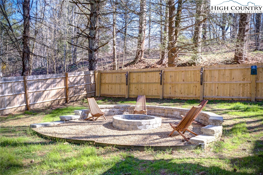 148 Fox Hill Road Vilas, NC 28692 - Photo 15 of 25 a view of a backyard with wooden fence