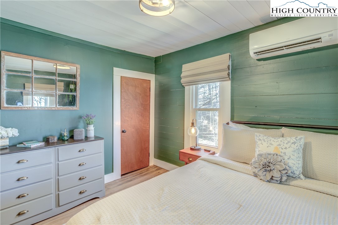 148 Fox Hill Road Vilas, NC 28692 - Photo 17 of 25 a bedroom with a bed and a window