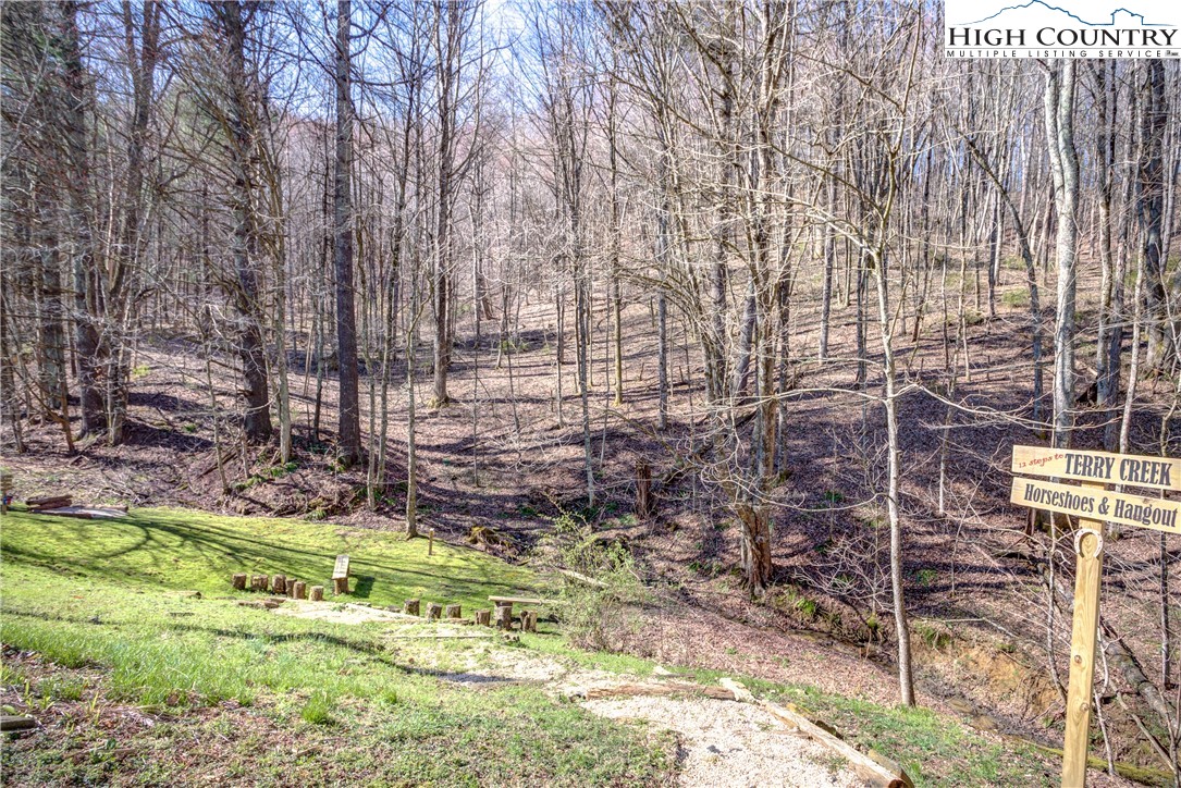 148 Fox Hill Road Vilas, NC 28692 - Photo 25 of 25 a backyard of a house with a yard and outdoor seating