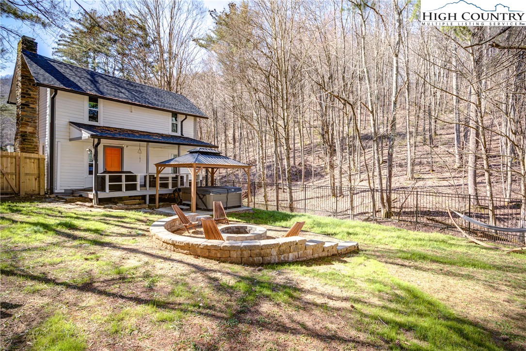 148 Fox Hill Road Vilas, NC 28692 - Photo 3 of 25 a view of a house with backyard porch and sitting area