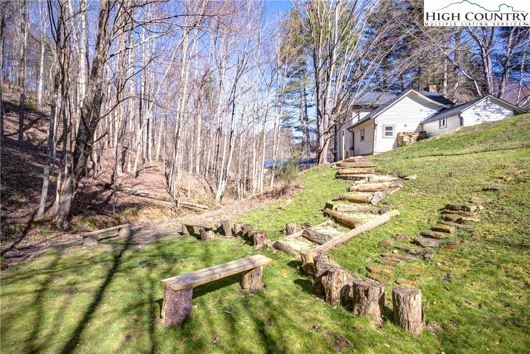 148 Fox Hill Road Vilas, NC 28692 - Photo 4 of 25 a backyard of a house with lots of green space