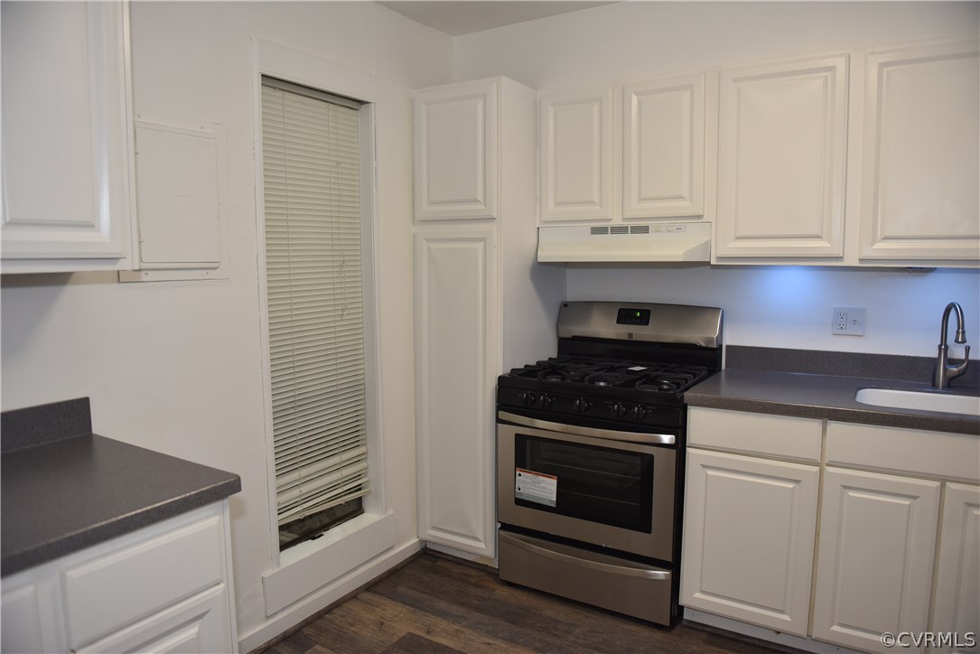 10320 Iron Mill Road, Unit 10320 Richmond, VA 23235 - Photo 2 of 14 a kitchen with white cabinets and appliances