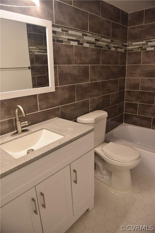 10320 Iron Mill Road, Unit 10320 Richmond, VA 23235 - Photo 4 of 14 a bathroom with a toilet a sink and mirror