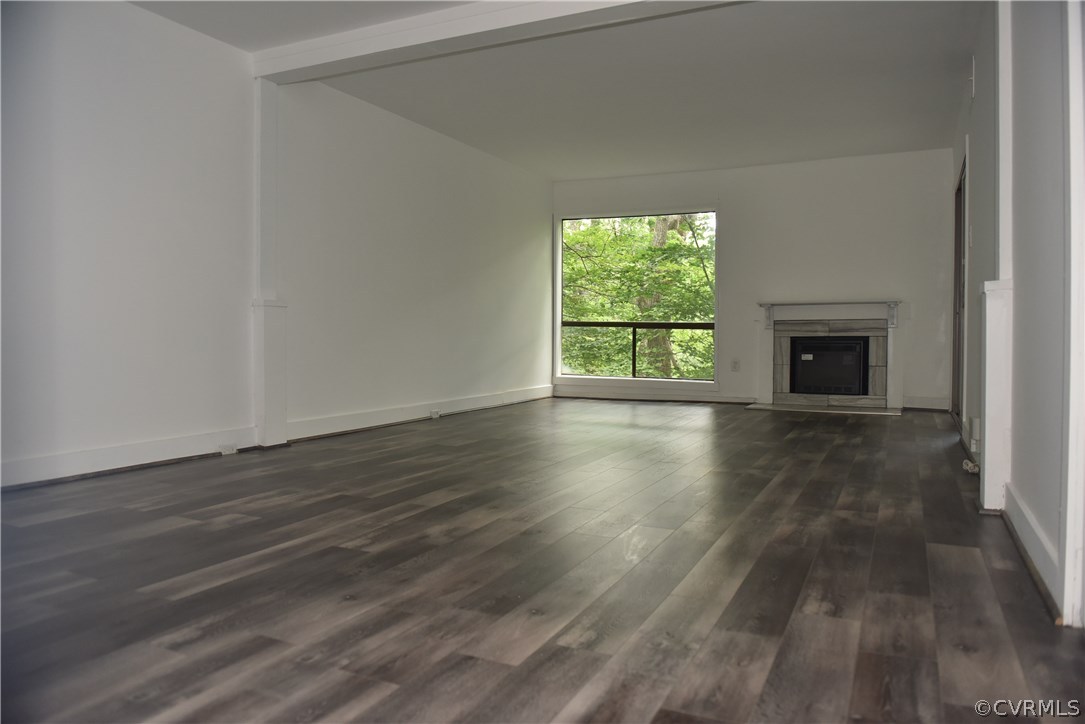 10320 Iron Mill Road, Unit 10320 Richmond, VA 23235 - Photo 7 of 14 a view of an empty room with wooden floor and a window