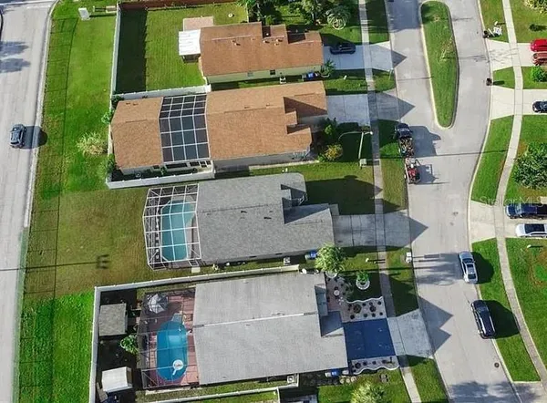 an aerial view of multiple houses with outdoor space