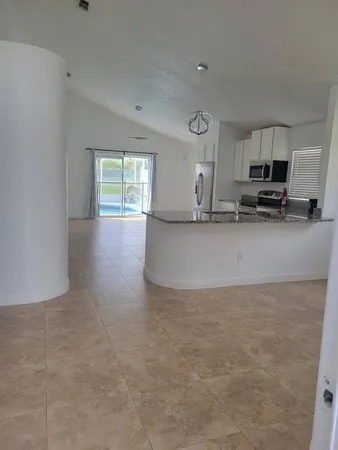 a view of a kitchen with a sink