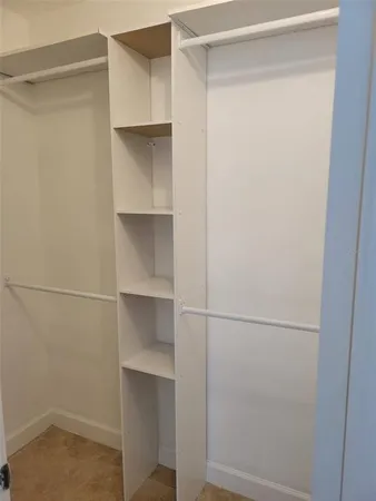 a view of an empty walk in closet