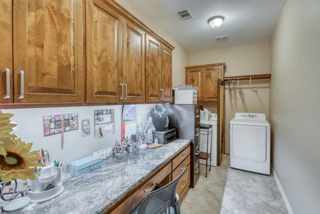 a kitchen with sink refrigerator and microwave