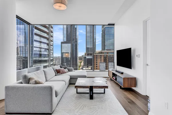 a living room with furniture and a flat screen tv