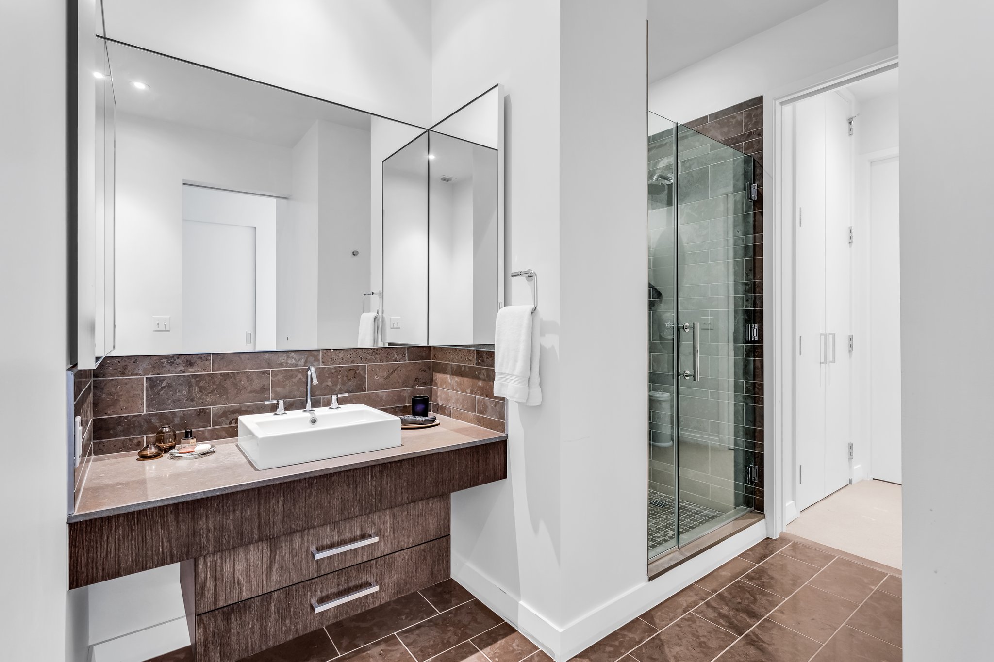 210 Lavaca Street, Unit 2308 Austin, TX 78701 - Photo 21 of 40 a bathroom with a sink and a mirror