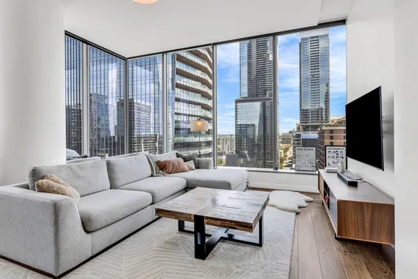 a living room with furniture and a flat screen tv