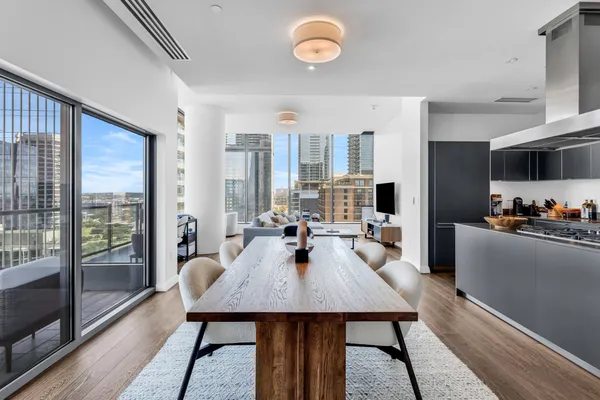 a view of a dining room with furniture window and wooden floor