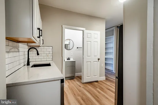 a view of a hardwood & utility room