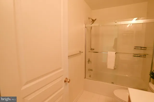 a bathroom with a shower and a toilet