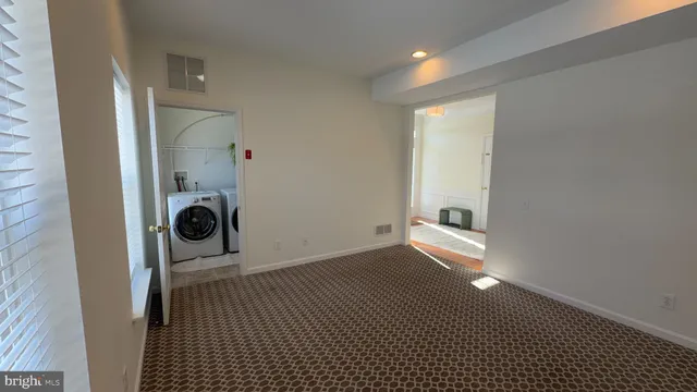 a bathroom with a sink and a washing machine