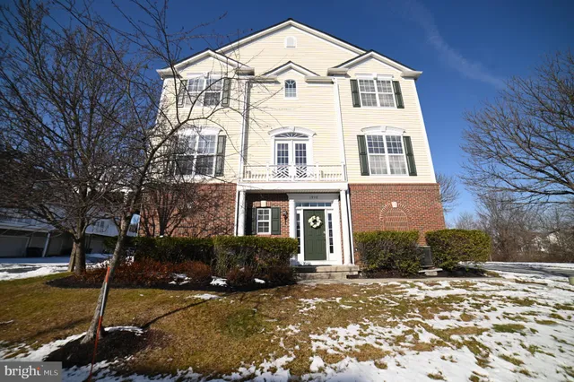 a view of a white house with a yard