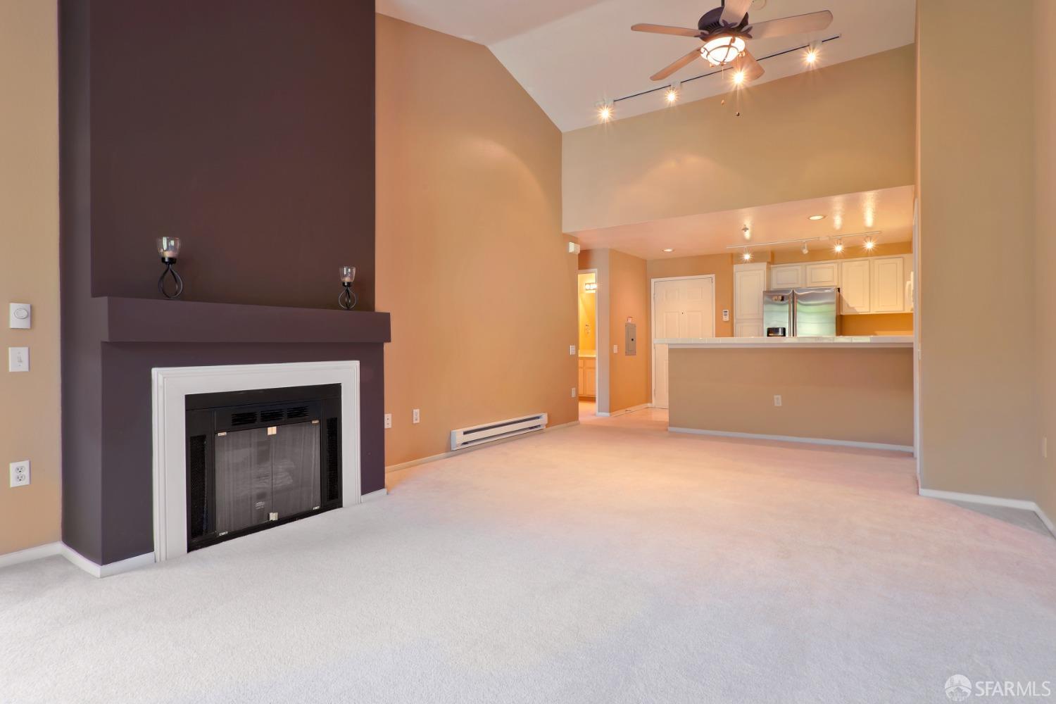 320 Caldecott Lane, Unit 331 Oakland, CA 94618 - Photo 3 of 14 a view of an empty room with a fireplace