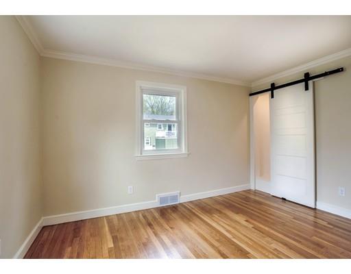 14 Leonard Street Hingham, MA 02043 - Photo 12 of 15 a view of an empty room with wooden floor and a window