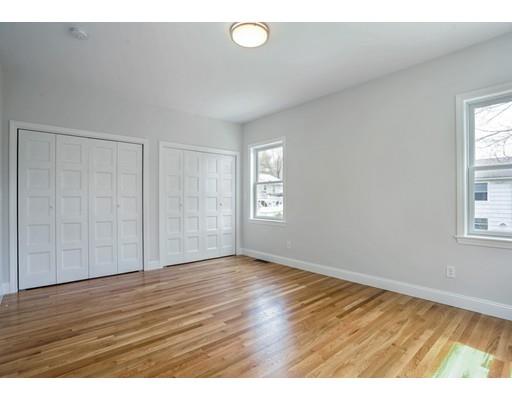 14 Leonard Street Hingham, MA 02043 - Photo 13 of 15 a view of an empty room with wooden floor and a window