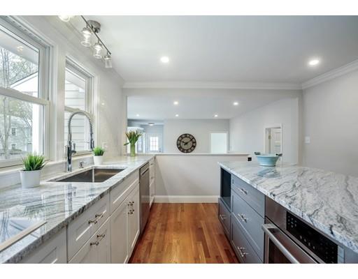 14 Leonard Street Hingham, MA 02043 - Photo 4 of 15 a large kitchen with granite countertop a large counter space sink and cabinets
