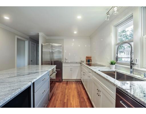14 Leonard Street Hingham, MA 02043 - Photo 5 of 15 a kitchen with a sink dishwasher a stove and white cabinets with wooden floor