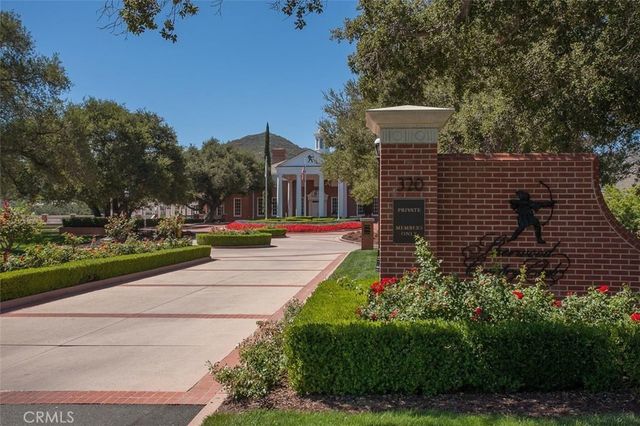 a view of the pathway and a building in the background