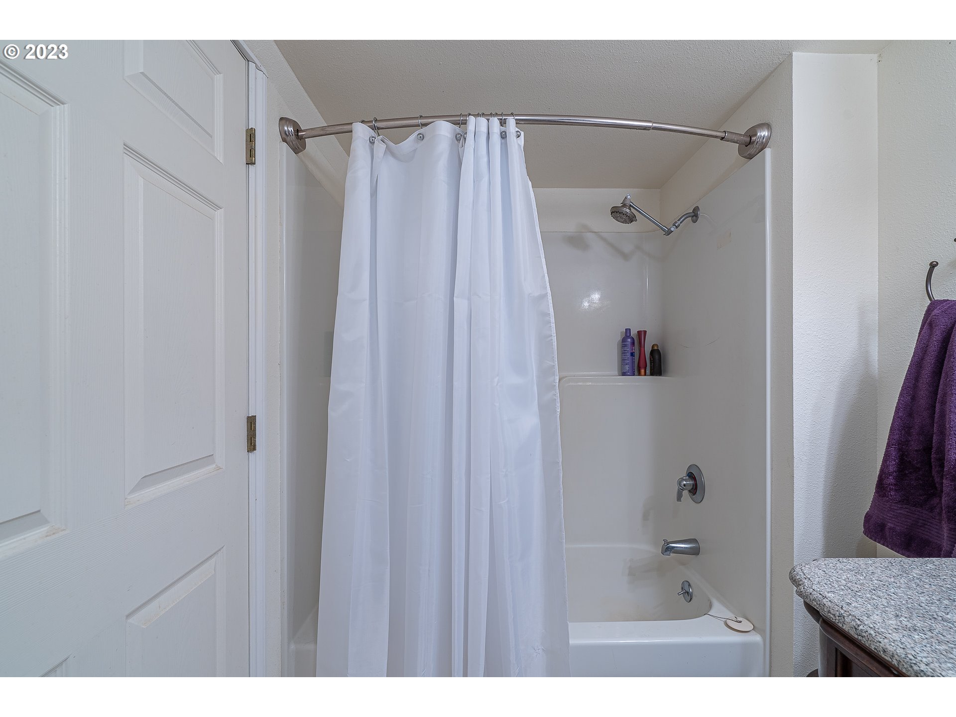 33554 Kauffman Road Lebanon, OR 97355 - Photo 20 of 30 a bathroom with a shower curtain and a bath tub