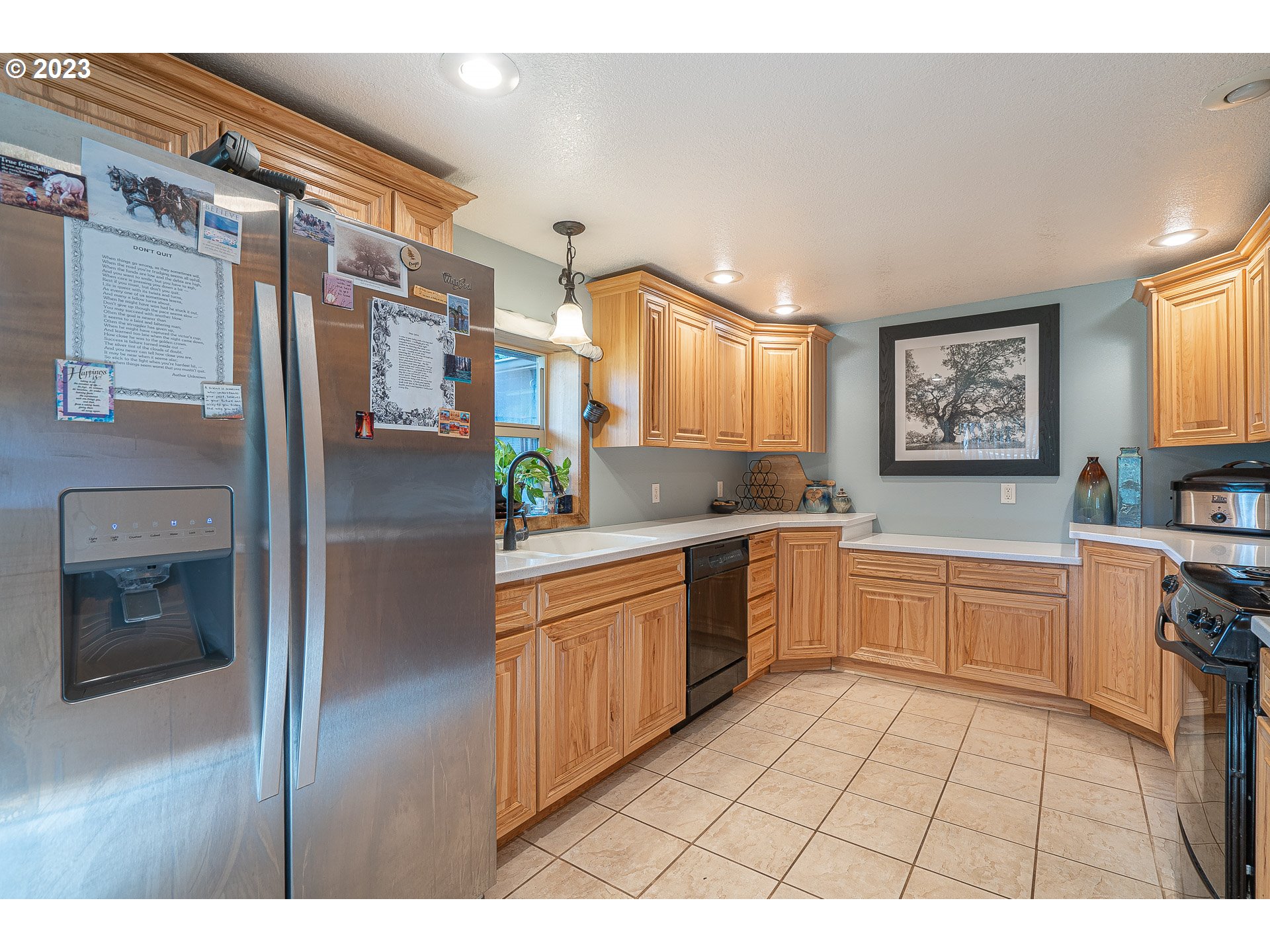 33554 Kauffman Road Lebanon, OR 97355 - Photo 4 of 30 a kitchen with stainless steel appliances granite countertop a refrigerator and a stove top oven