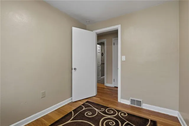 a view of a livingroom with wooden floor