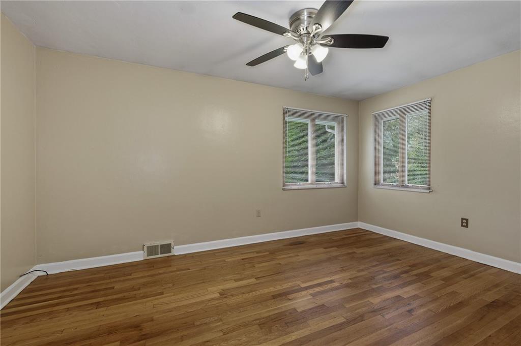690 Pearce Mill Road Wexford, PA 15090 - Photo 15 of 38 a view of a room with wooden floor and a ceiling fan