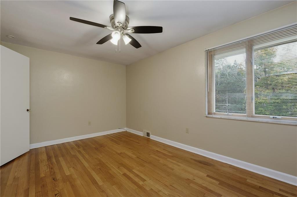 690 Pearce Mill Road Wexford, PA 15090 - Photo 17 of 38 a view of empty room with wooden floor and fan